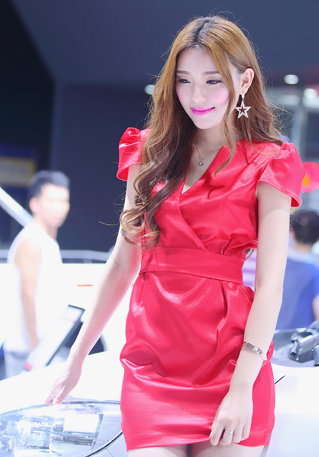 The girl in red at the 2014 Shenzhen International Auto Show